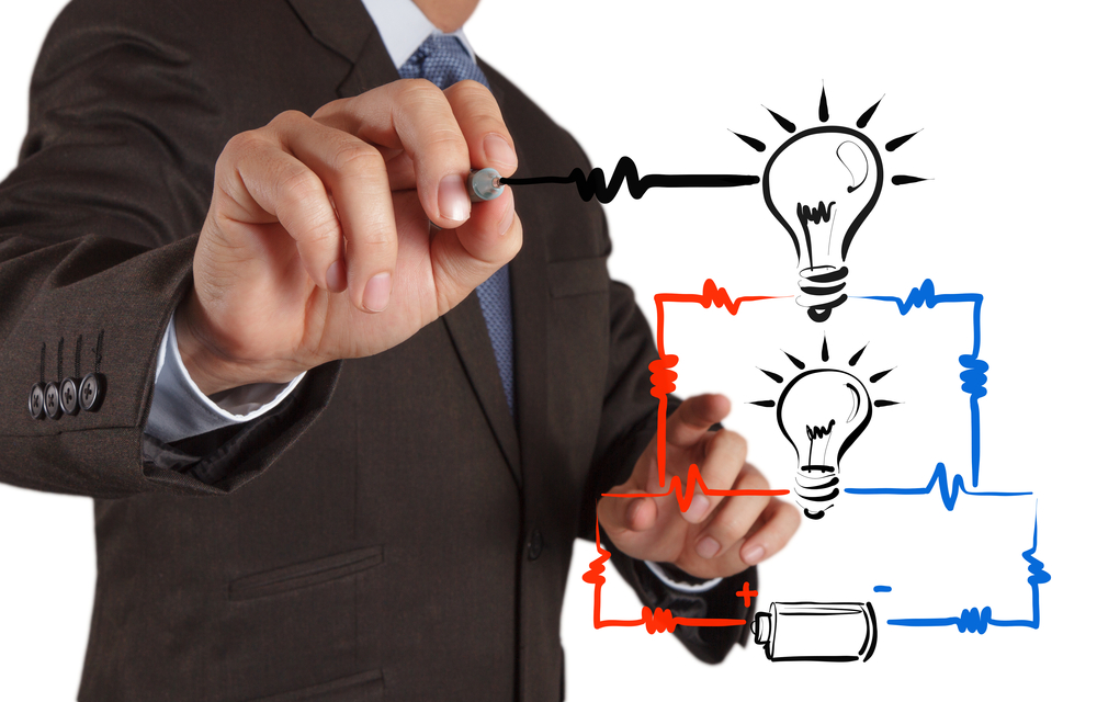 businessman hand draws electrical diagram - series and parallel connection concept