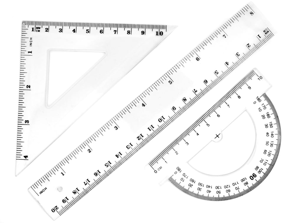 close up of different rulers and  school supplies on white background with clipping path